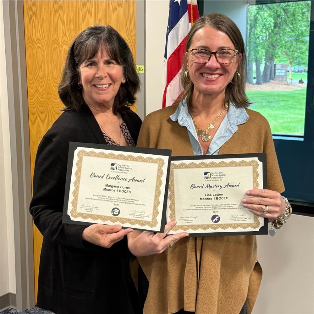  M. Burns and L. Latten holding their certificates from NYSSBA